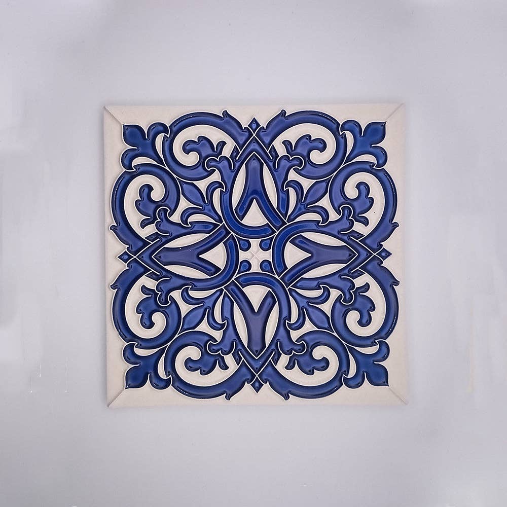 The Ceramic Tiles For Decoration by Tejo Shop feature an ornate, symmetrical blue pattern inspired by Portuguese designs, with curved floral and vine motifs on a white background and a delicate border, creating a handcrafted look.