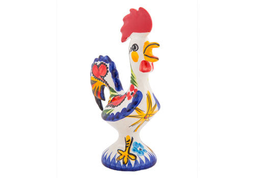 The Barcelos Imports Carnival Rooster is a ceramic figurine featuring a red comb, yellow beak, and bold blue, yellow, and red patterns—highlighting Portuguese artistry on a decorative base.