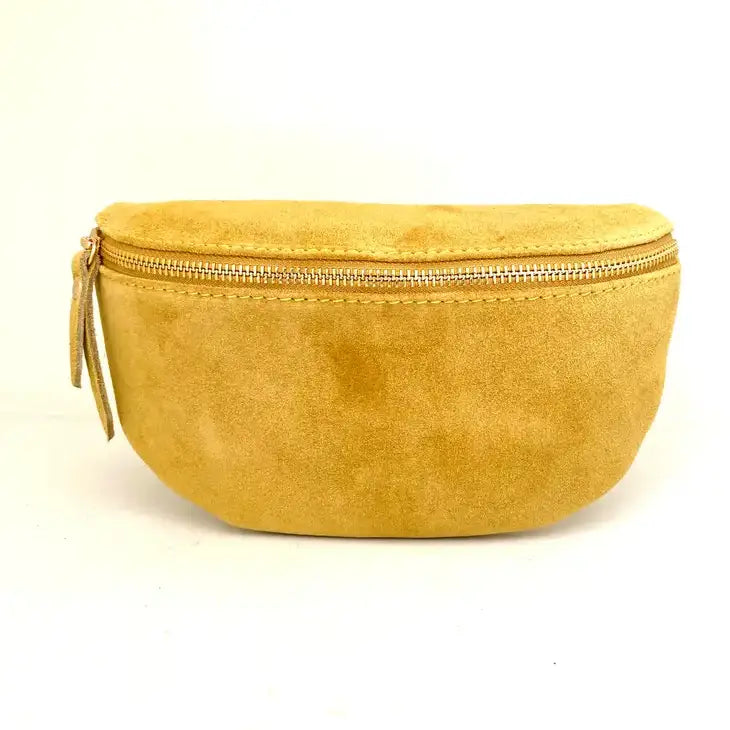 The Cassette Barcelona Suede Fanny Pack Crossbody in tan, featuring a gold zipper and matching pull tab, is made in Italy and shown against a plain white background.