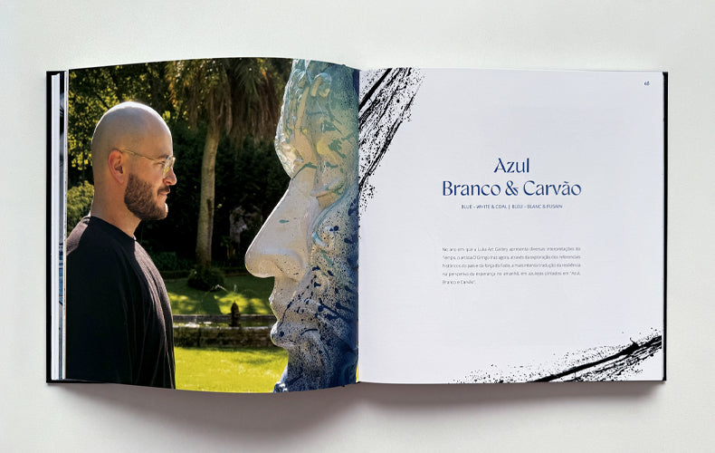 Open book showing a man and a sculpture with text on a white background