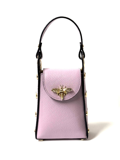 Close-up of top handles and leather texture on the Bee Crossbag.