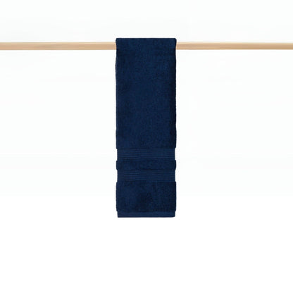 Cobalt blue towel hanging on rail in a modern bathroom