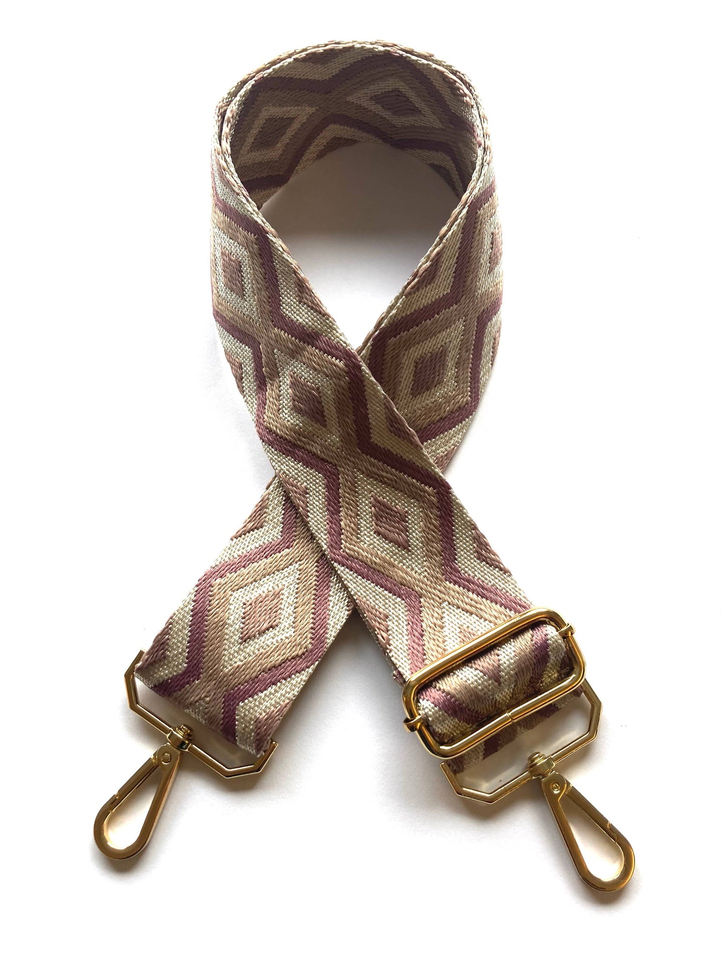 Close-up of diamond weave and gold clip hardware on adjustable strap.