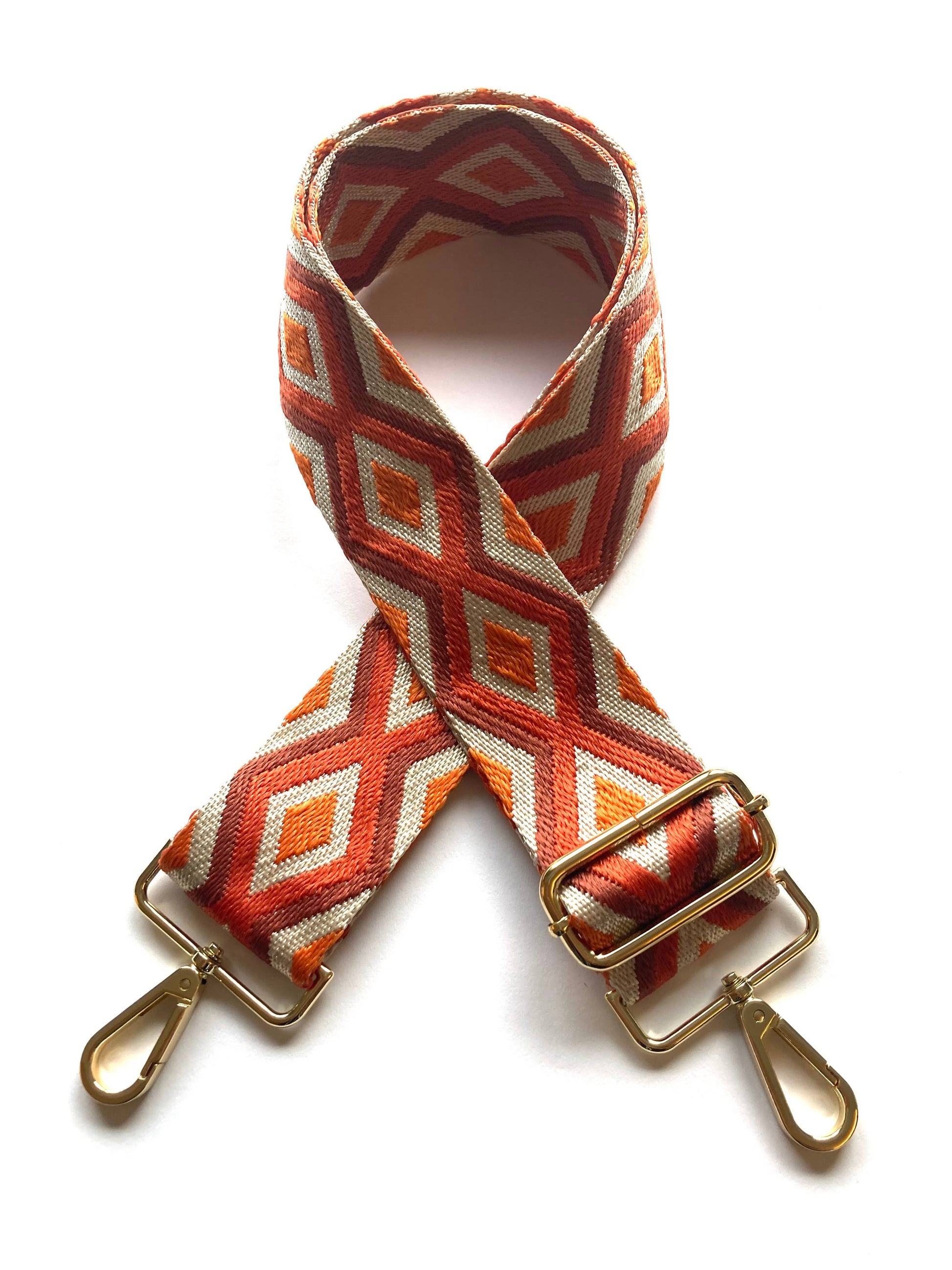 Full-length flat lay of orange, red and beige diamond strap, 60–115 cm adjustable.
