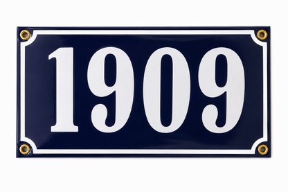 A handmade navy blue rectangular Enamel House Number sign by Luis Filipe, crafted in Portugal, featuring the bold white numbers "1909" and finished with four gold rivets in each corner.