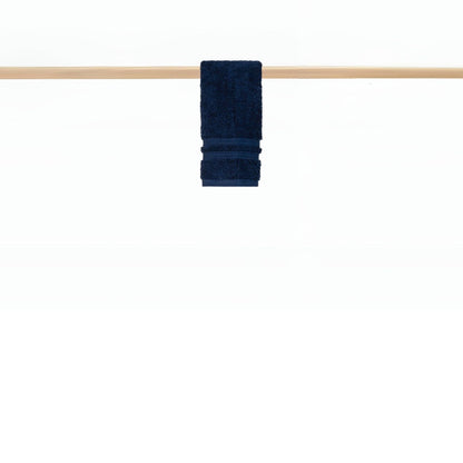 : Cobalt blue hand towel hanging on rail in a modern bathroom