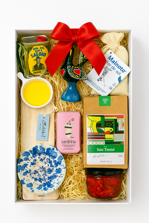 Discover the Iberica Gourmet hamper #1 by Iberica - Pretty things from Portugal, an artisanal gift box featuring olive oil, a ceramic rooster, sardines, sea salt, coffee, a blue dish, yellow pourer, wooden board, and red candy.