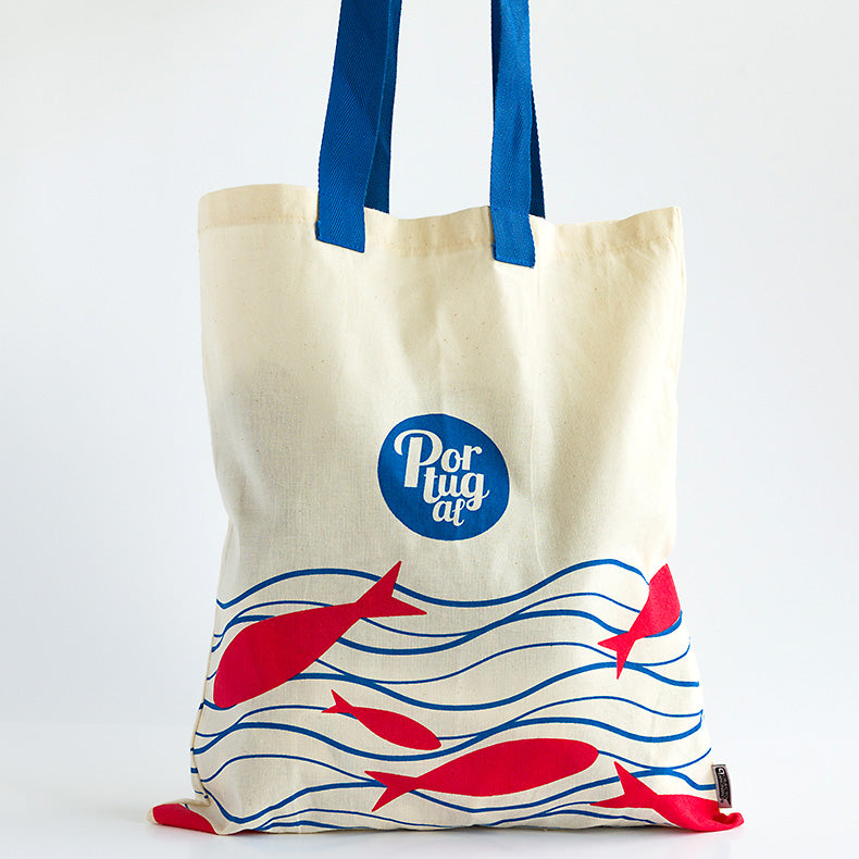 Portuguese cotton bag with red fishes and blue lines representing the sea