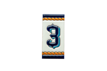 The Marine Ceramic House Number & Letter Tile by LVR Ceramics features a blue number 3 on white, outlined in black with orange rope borders for a nautical Mediterranean touch.