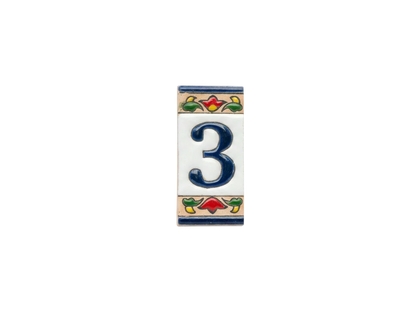 Mini Chilli Ceramic House Number & Letter Tile featuring a rectangular ceramic number three in blue, accented by small floral motifs at the top and bottom in the style of handcrafted Spanish tiles.