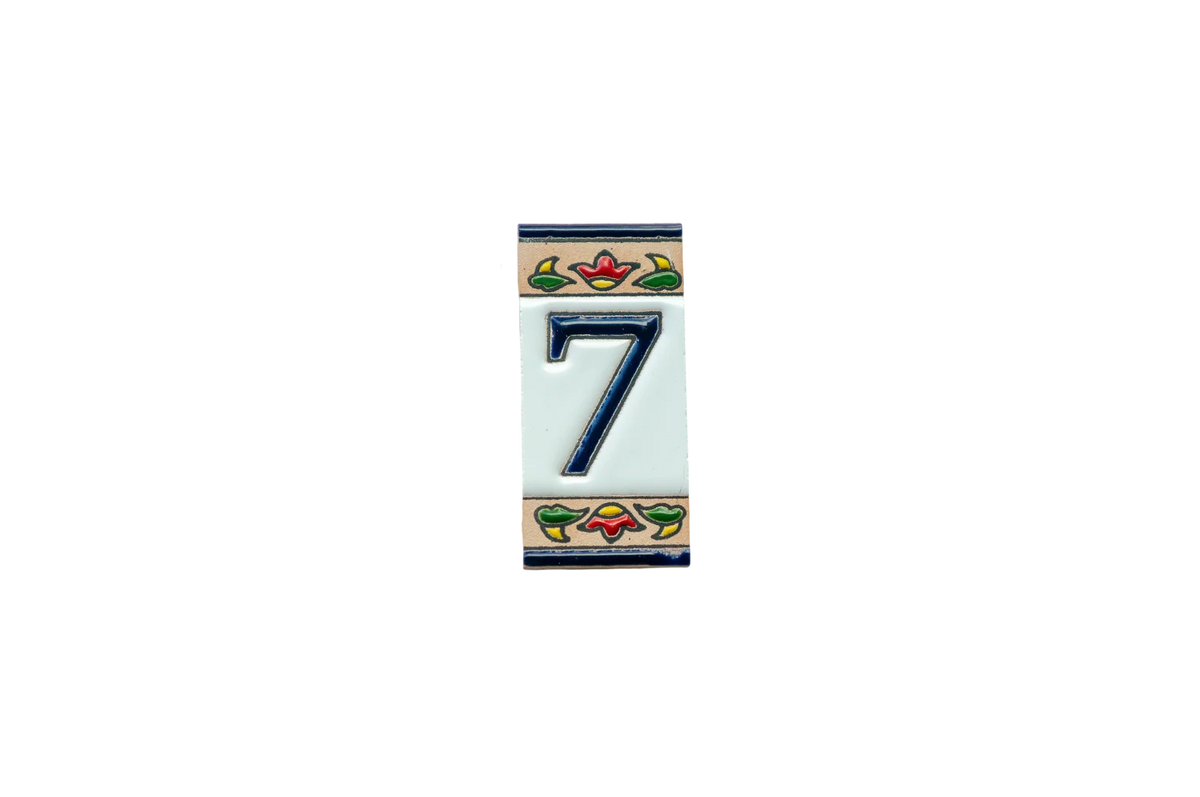 LVR Ceramics Mini Chilli Ceramic House Number & Letter Tile featuring the number seven in dark blue with colorful floral borders at the top and bottom in the style of handcrafted Spanish tiles.