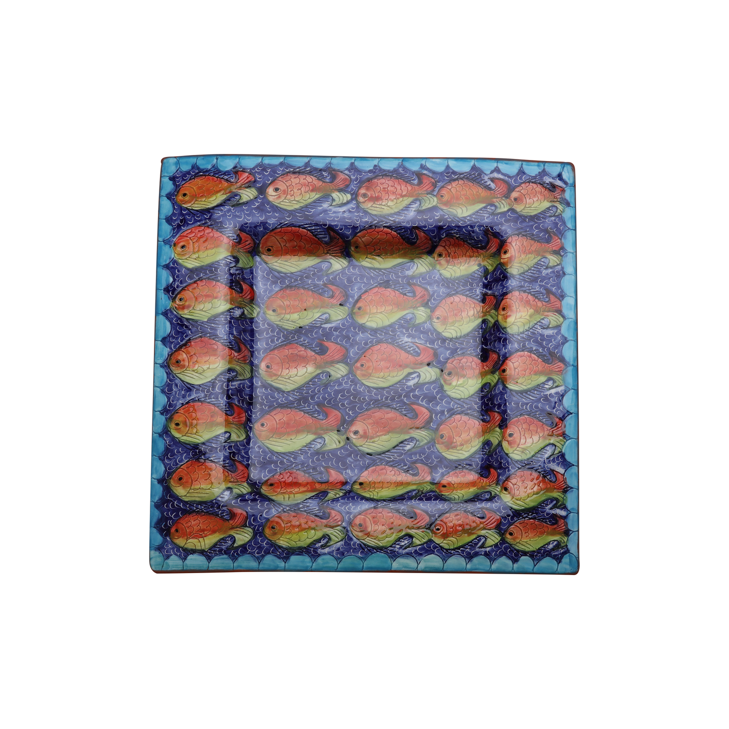 The Fishes Serving Set by Iberica – Pretty things from Portugal includes a square ceramic plate with red and orange fish on a blue background, bordered with blue and turquoise, inspired by Portuguese coastal ceramics.