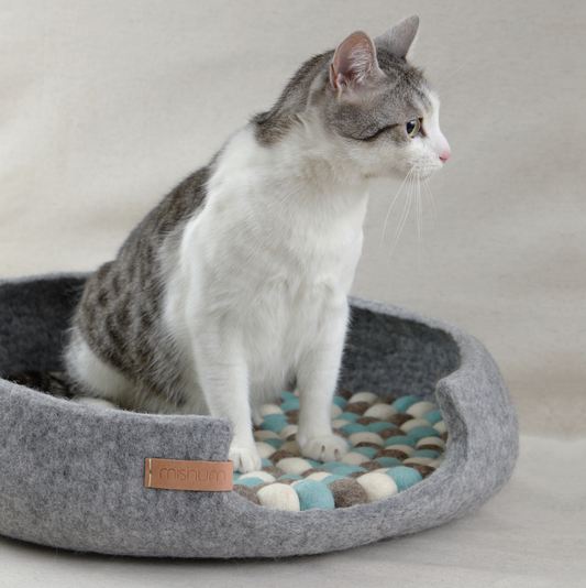 Simona silver wool felt pet bed with cat resting inside