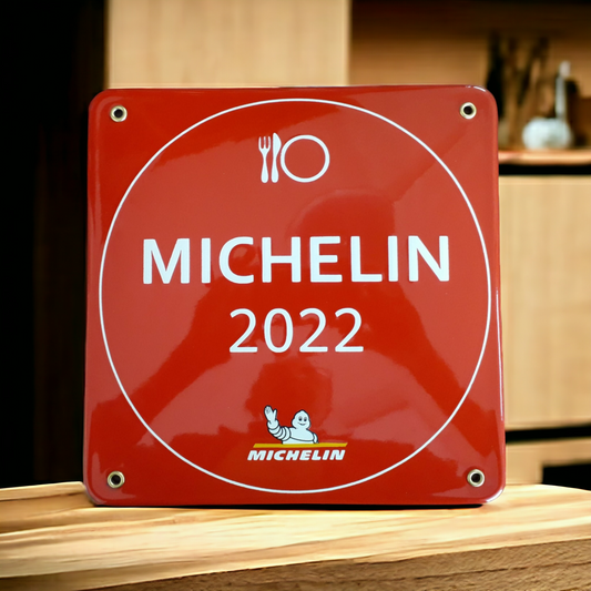 A Square Enamel Sign & Plaque by Luis Filipe, featuring "MICHELIN 2022" and the Michelin logo in red enamel, displayed on wood—denoting a prestigious Michelin restaurant award.
