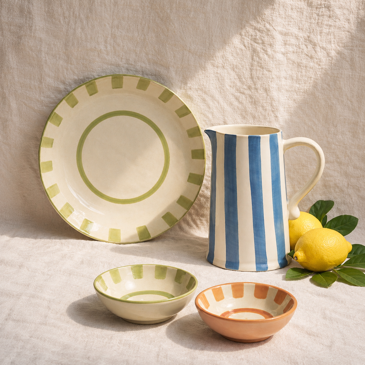 Handmade terracotta striped ceramic pitcher with organic stripe design