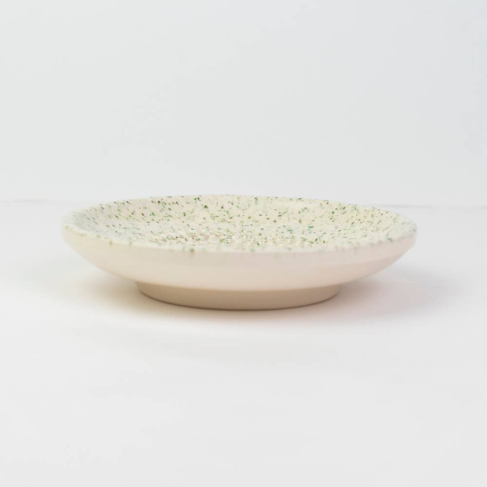 a ceramic grater plate in white and green 