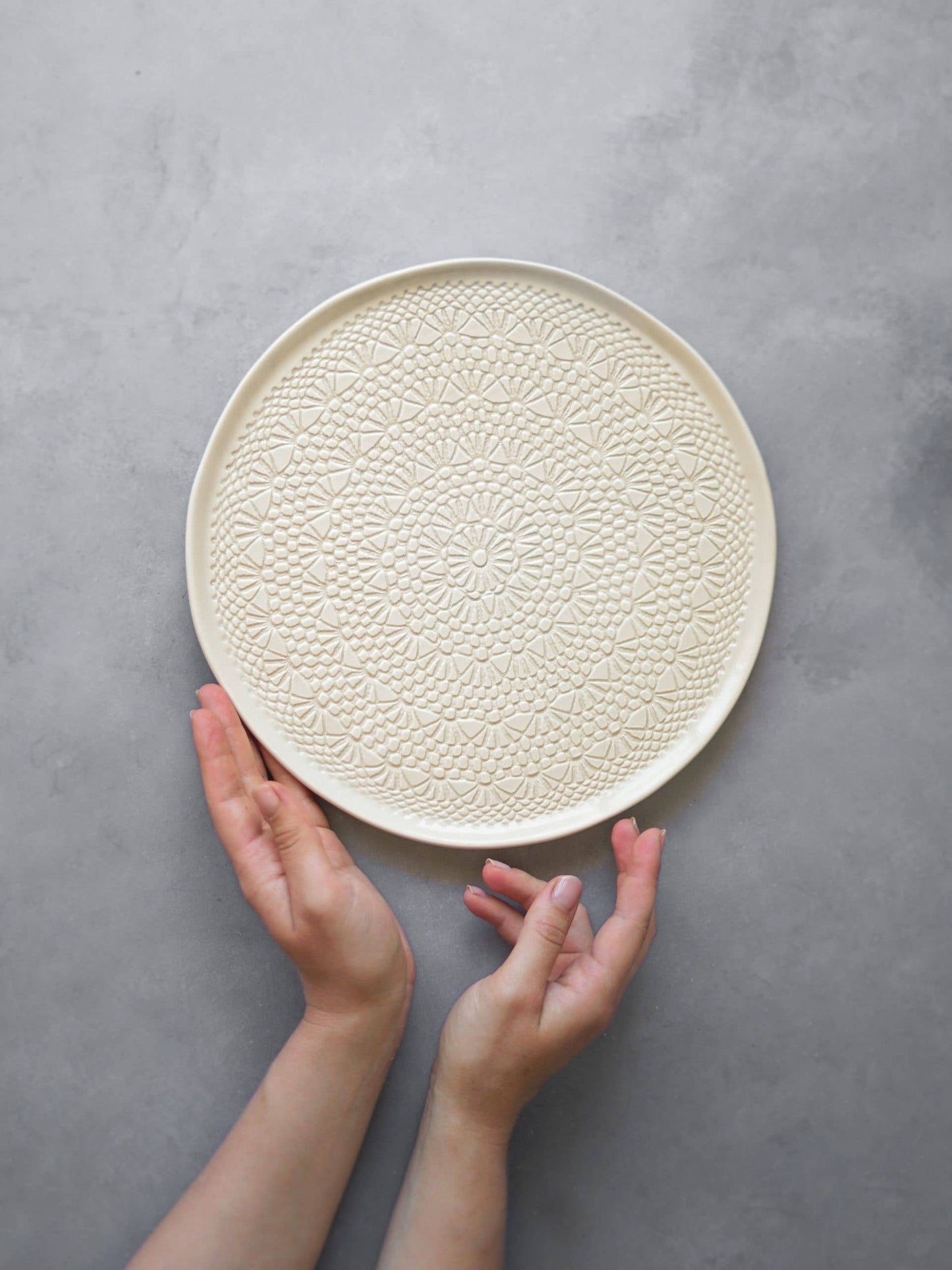cake plate with white crochet stencil detail