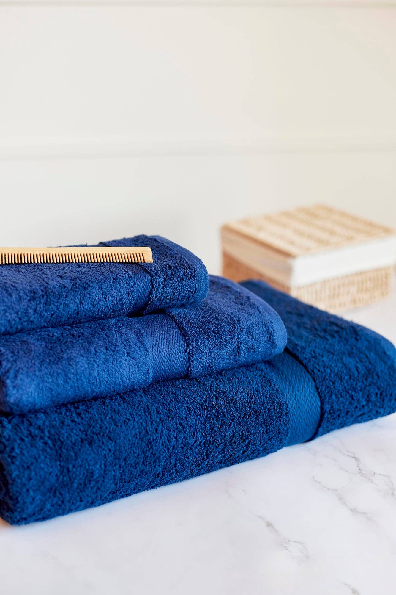 cobalt blue organic cotton towels on a bathroom counter